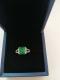 Split Shank Green Emerald Cut Engagement Rings